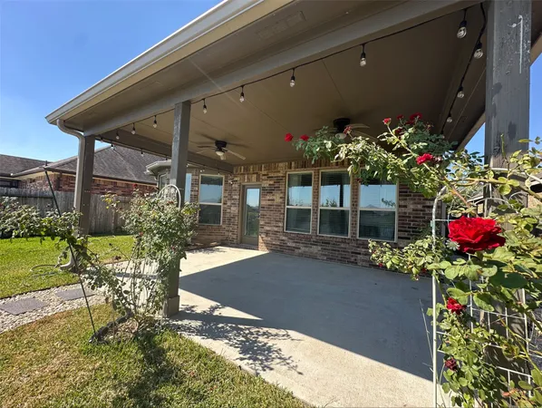 a front view of a house with a yard and a bench
