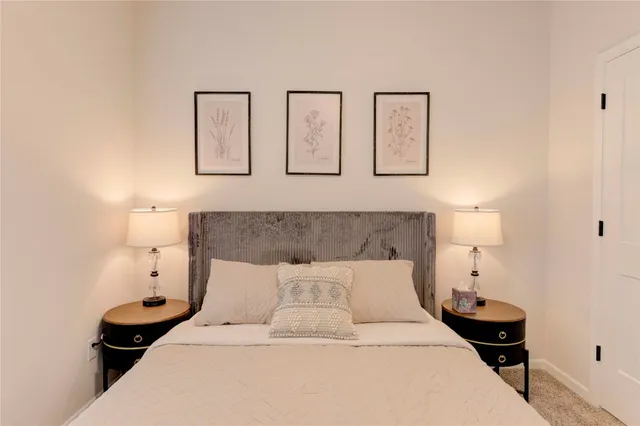 a bed room with a bed and night stand