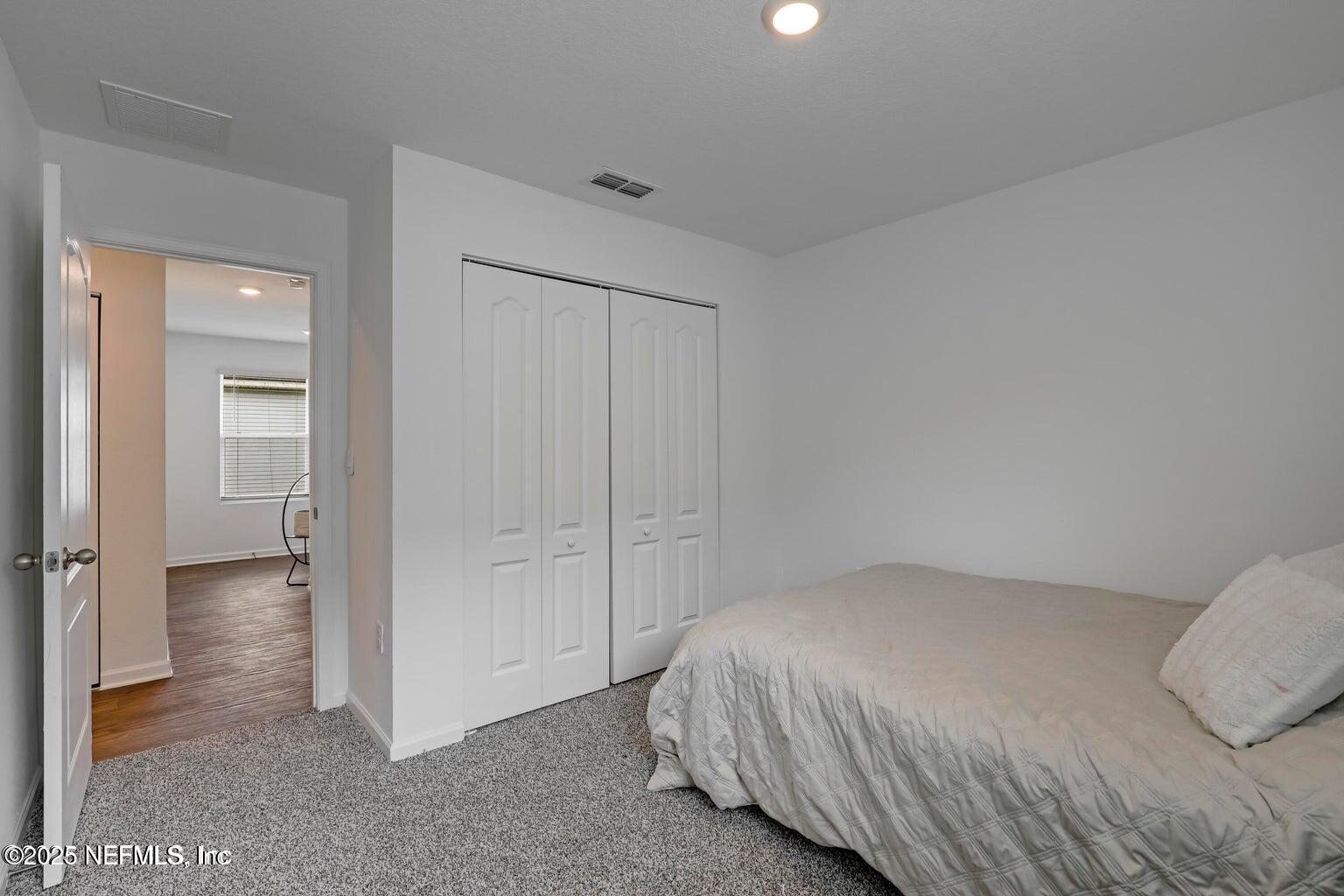 12633 Cacao Tree Trail Jacksonville, FL 32218 - Photo 12 of 44 a bed room with a bed and a view