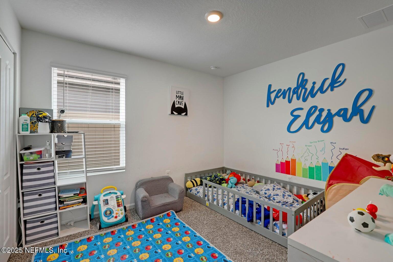 12633 Cacao Tree Trail Jacksonville, FL 32218 - Photo 20 of 44 a book and a table in a bedroom