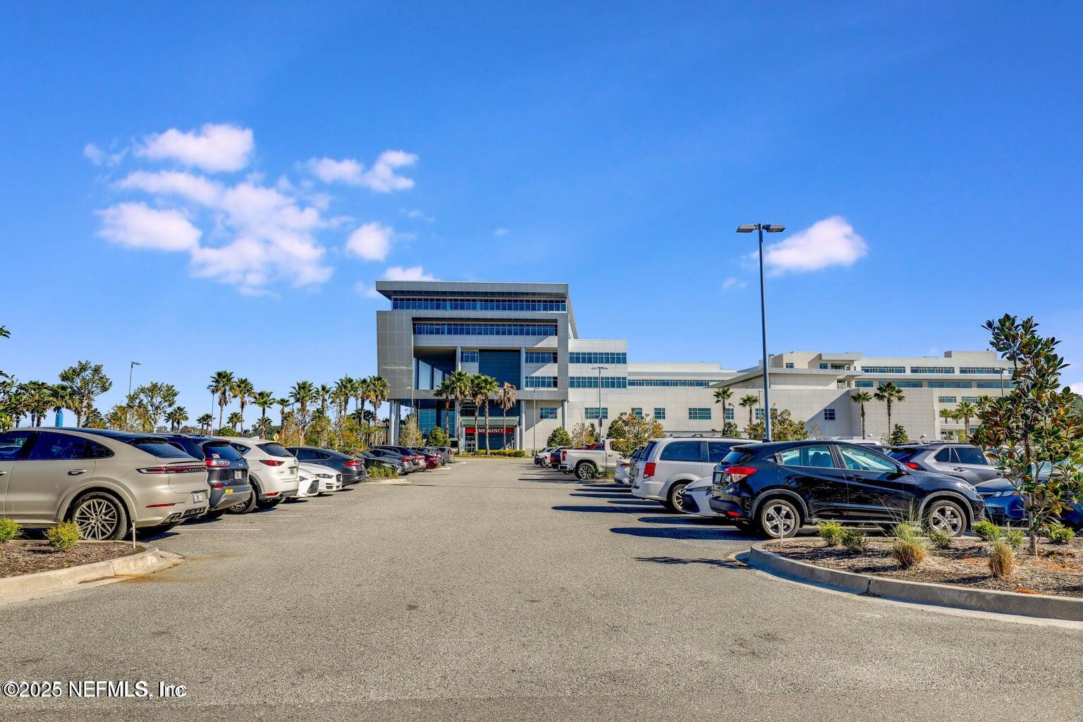 12633 Cacao Tree Trail Jacksonville, FL 32218 - Photo 40 of 44 an outdoor space with lots of cars parked in front of it