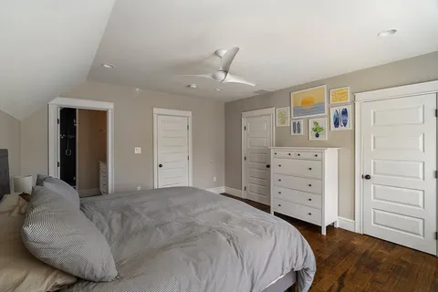 a bedroom with a bed and a dresser