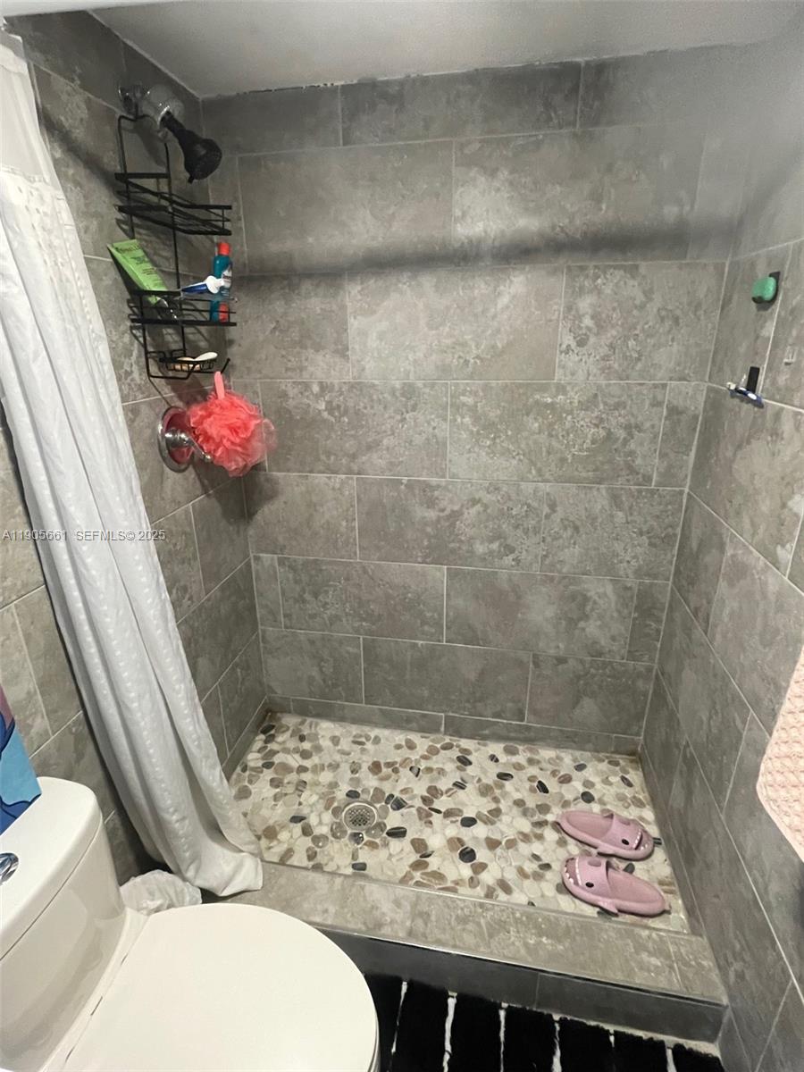 4500 North Federal Highway, Unit 102A Lighthouse Point, FL 33064 - Photo 14 of 37 a bathroom with a toilet