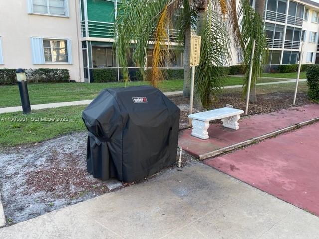 4500 North Federal Highway, Unit 102A Lighthouse Point, FL 33064 - Photo 31 of 37 a view of a backyard with a garden and plants