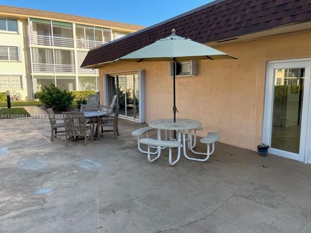 4500 North Federal Highway, Unit 102A Lighthouse Point, FL 33064 - Photo 32 of 37 an outdoor view of patio with umbrella
