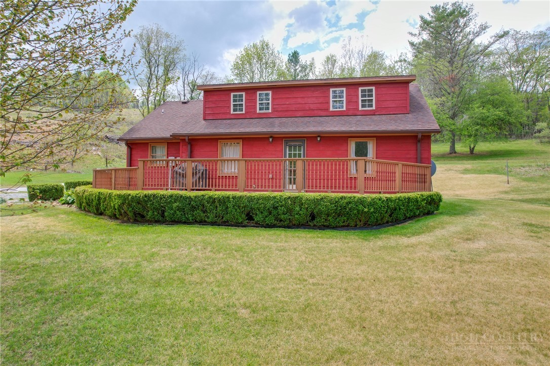 969 Allen Road Piney Creek, NC 28663 - Photo 1 of 50 a red brick house with trees in front of it