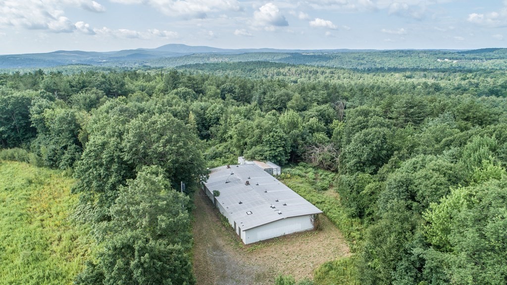 280 Sheldon Road Fitchburg, MA 01420 - Photo 4 of 9 an aerial view of a house with a yard and large trees