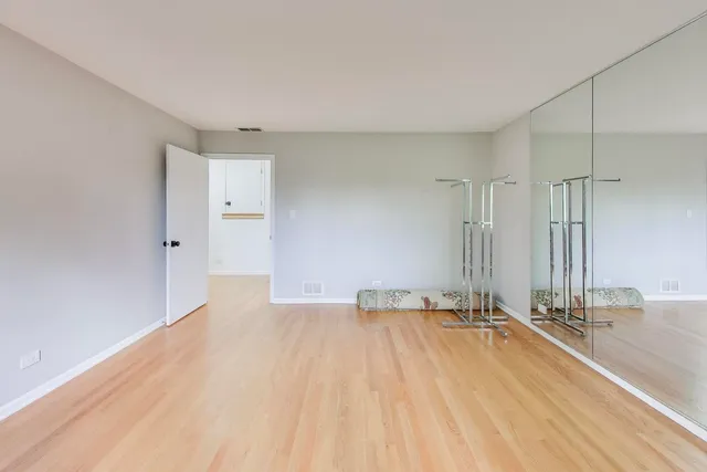 a bathroom with a shower sink vanity mirror and toilet