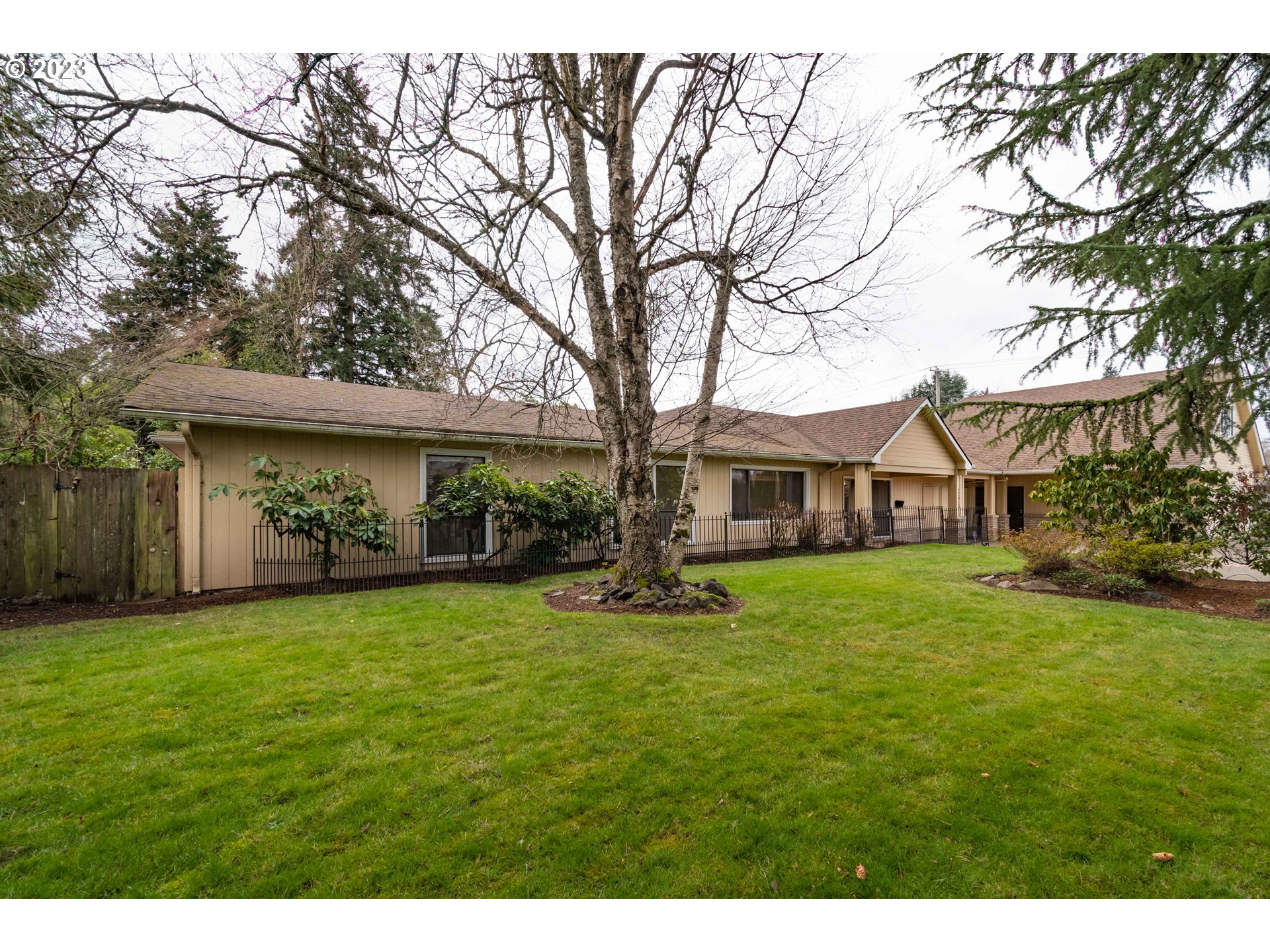 2210 Sandy Drive Eugene, OR 97401 - Photo 1 of 32 a front view of a house with a garden