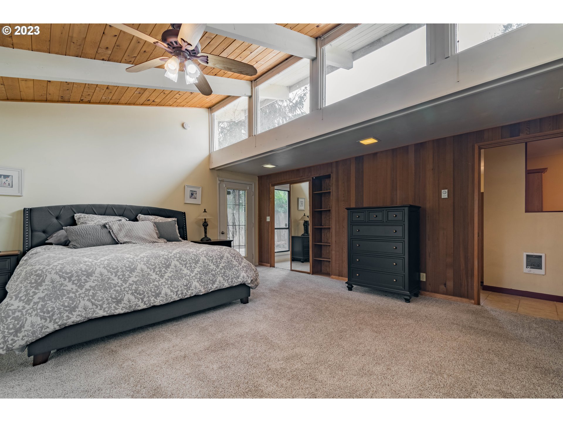 2210 Sandy Drive Eugene, OR 97401 - Photo 12 of 32 a spacious bedroom with a bed and a walk in closet
