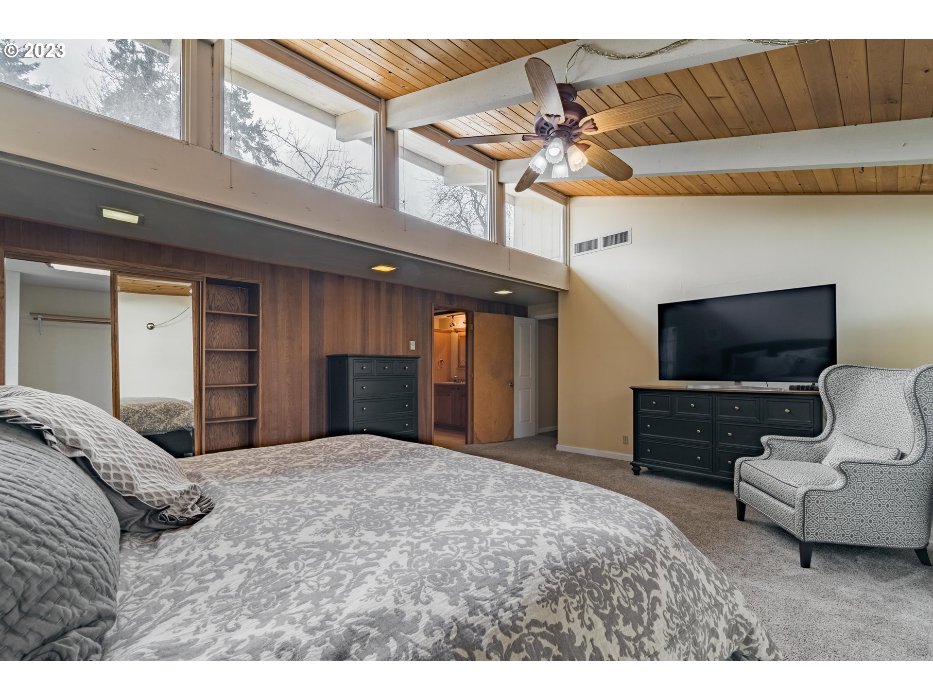 2210 Sandy Drive Eugene, OR 97401 - Photo 14 of 32 a bedroom with a bed and a television