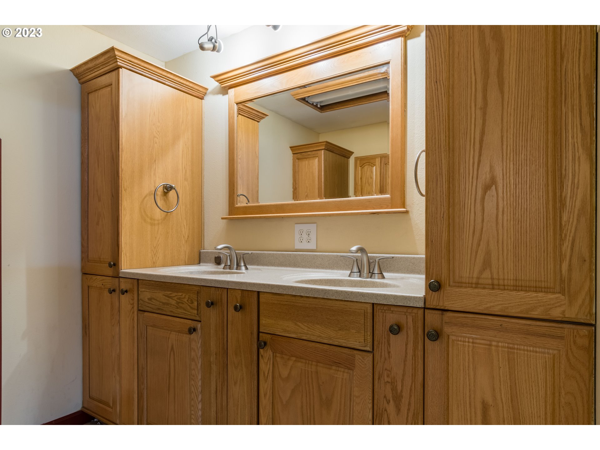 2210 Sandy Drive Eugene, OR 97401 - Photo 16 of 32 a bathroom with a sink and mirror
