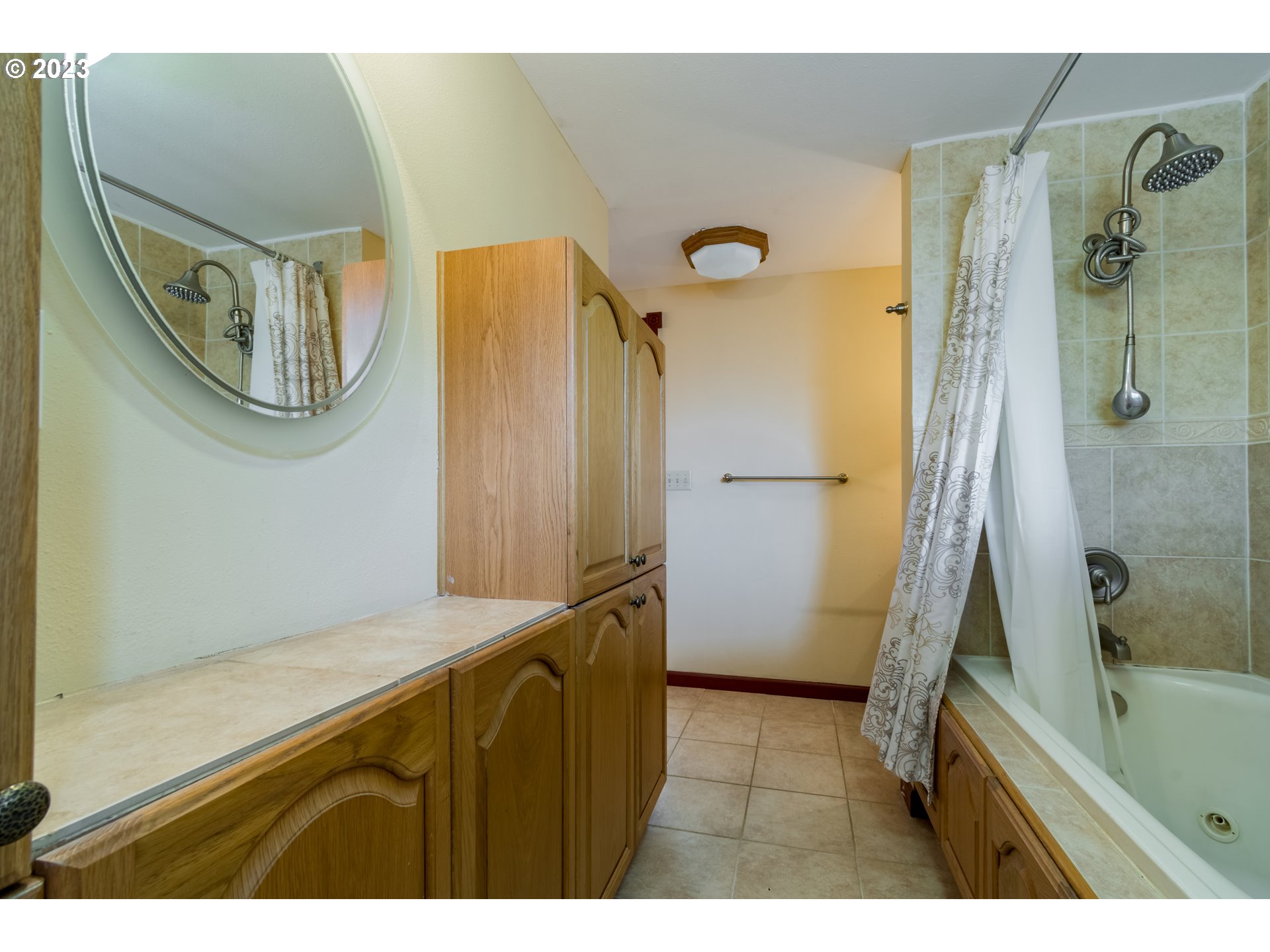 2210 Sandy Drive Eugene, OR 97401 - Photo 17 of 32 a bathroom with a bathtub and a shower