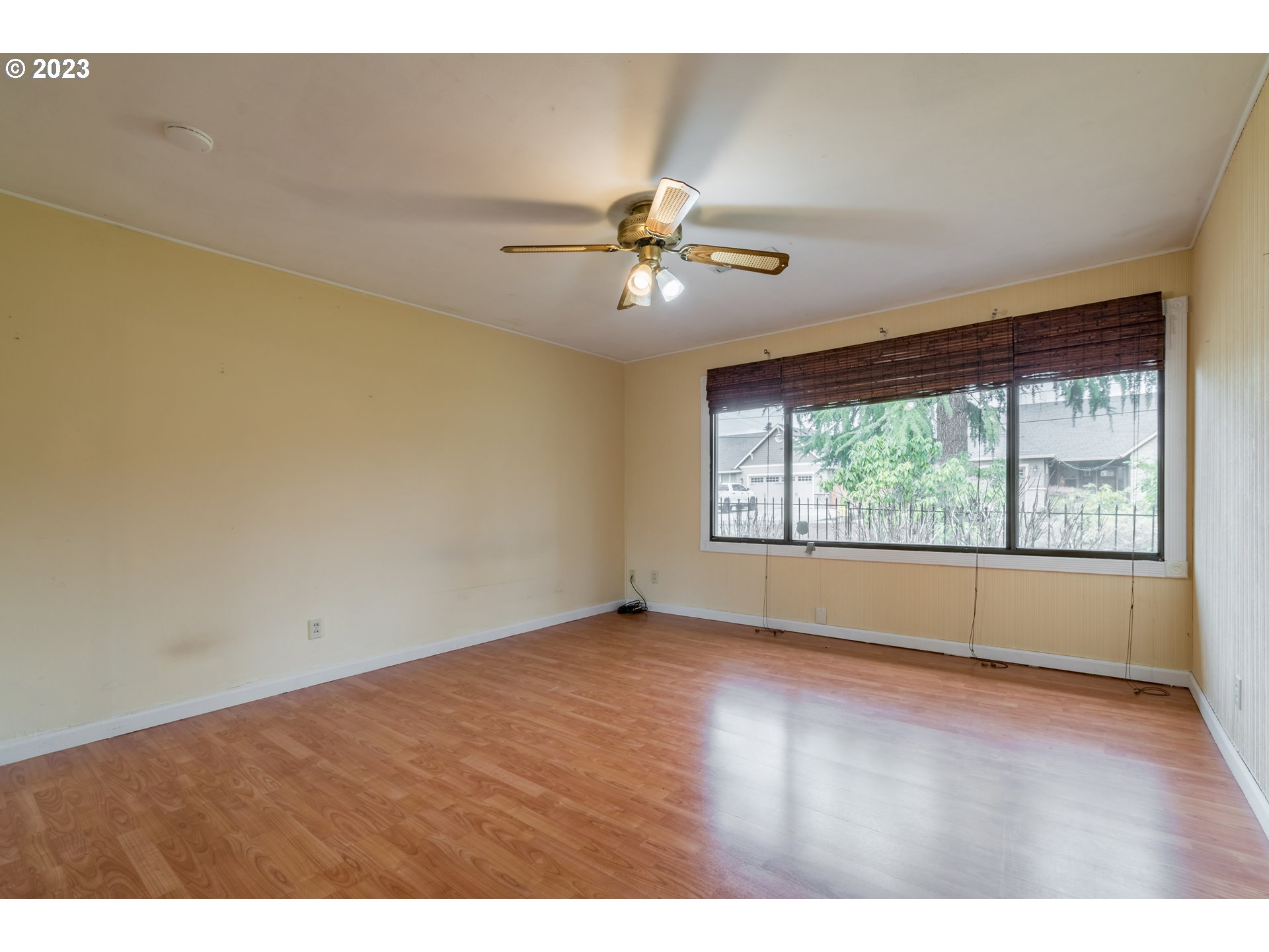 2210 Sandy Drive Eugene, OR 97401 - Photo 18 of 32 a view of an empty room with window and a ceiling fan