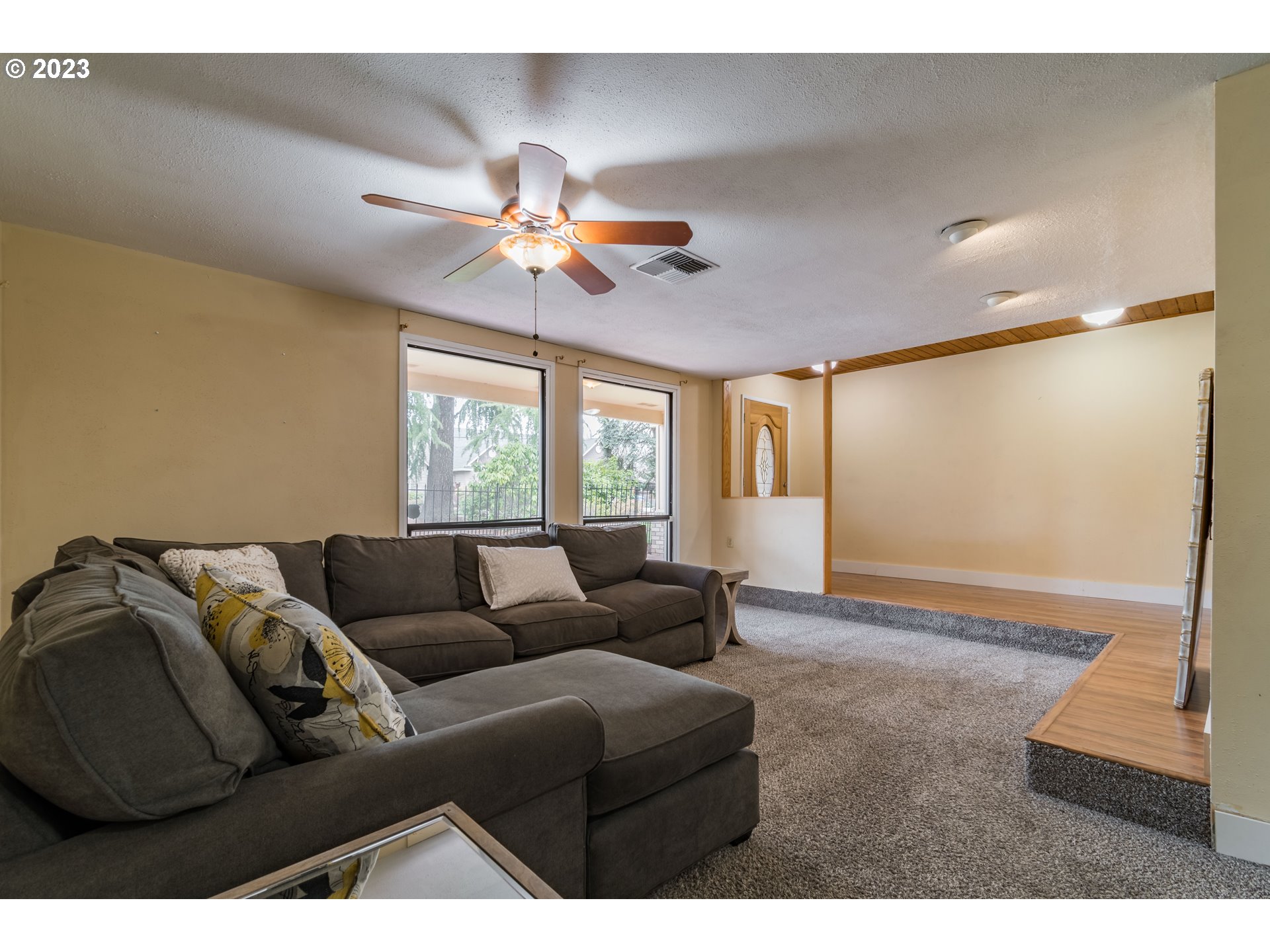 2210 Sandy Drive Eugene, OR 97401 - Photo 22 of 32 a living room with furniture and a window