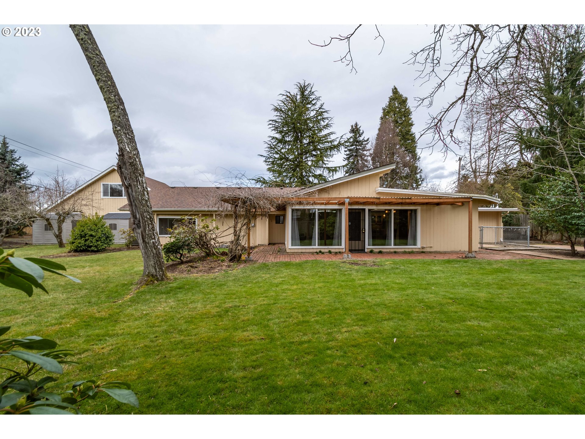 2210 Sandy Drive Eugene, OR 97401 - Photo 30 of 32 a front view of a house with a garden