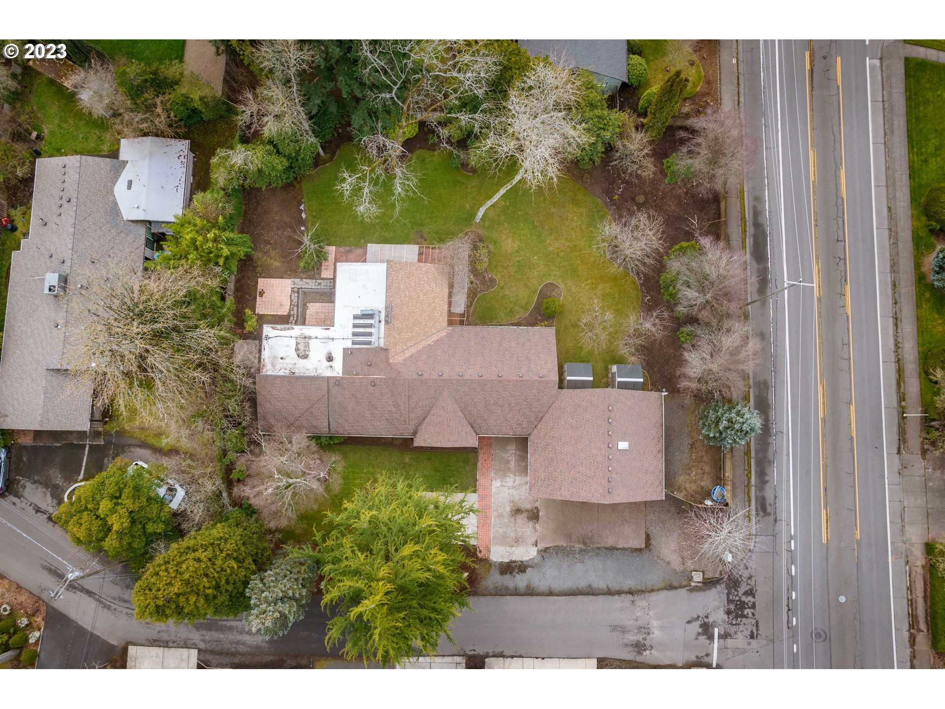 2210 Sandy Drive Eugene, OR 97401 - Photo 31 of 32 an aerial view of a house with a garden and yard