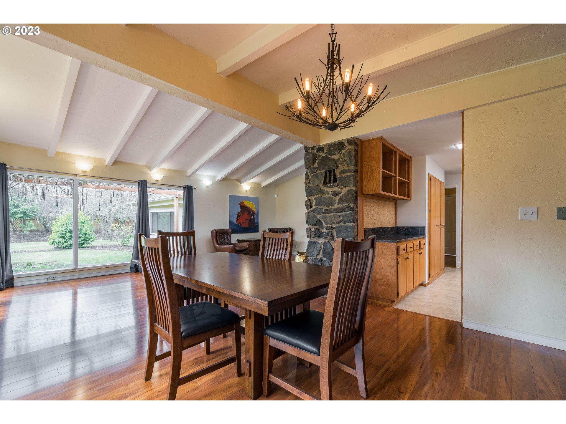 2210 Sandy Drive Eugene, OR 97401 - Photo 8 of 32 a view of a dining room with furniture wooden floor and chandelier