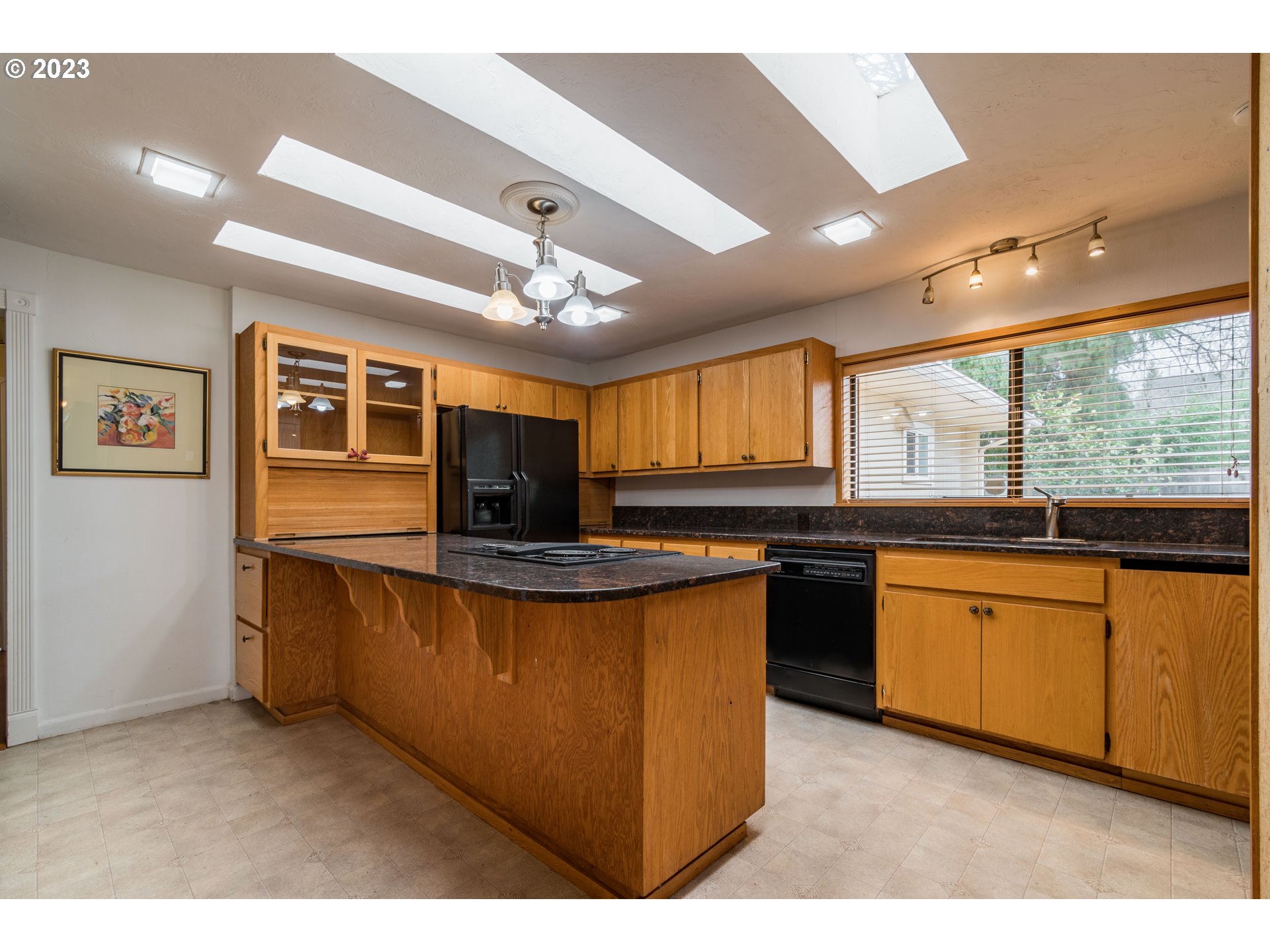 2210 Sandy Drive Eugene, OR 97401 - Photo 10 of 32 a kitchen with stainless steel appliances granite countertop sink stove and refrigerator