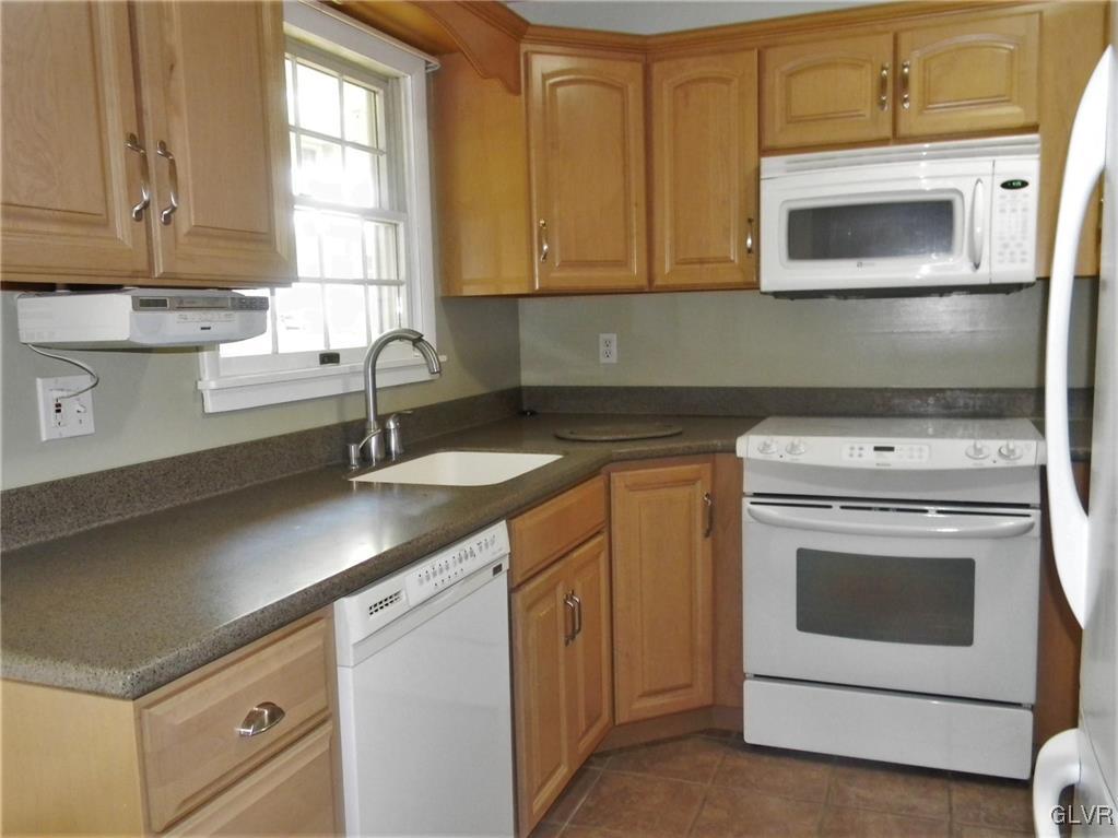 2613 Lower Saucon Road Hellertown, PA 18055 - Photo 9 of 32 a kitchen with a sink stove and microwave