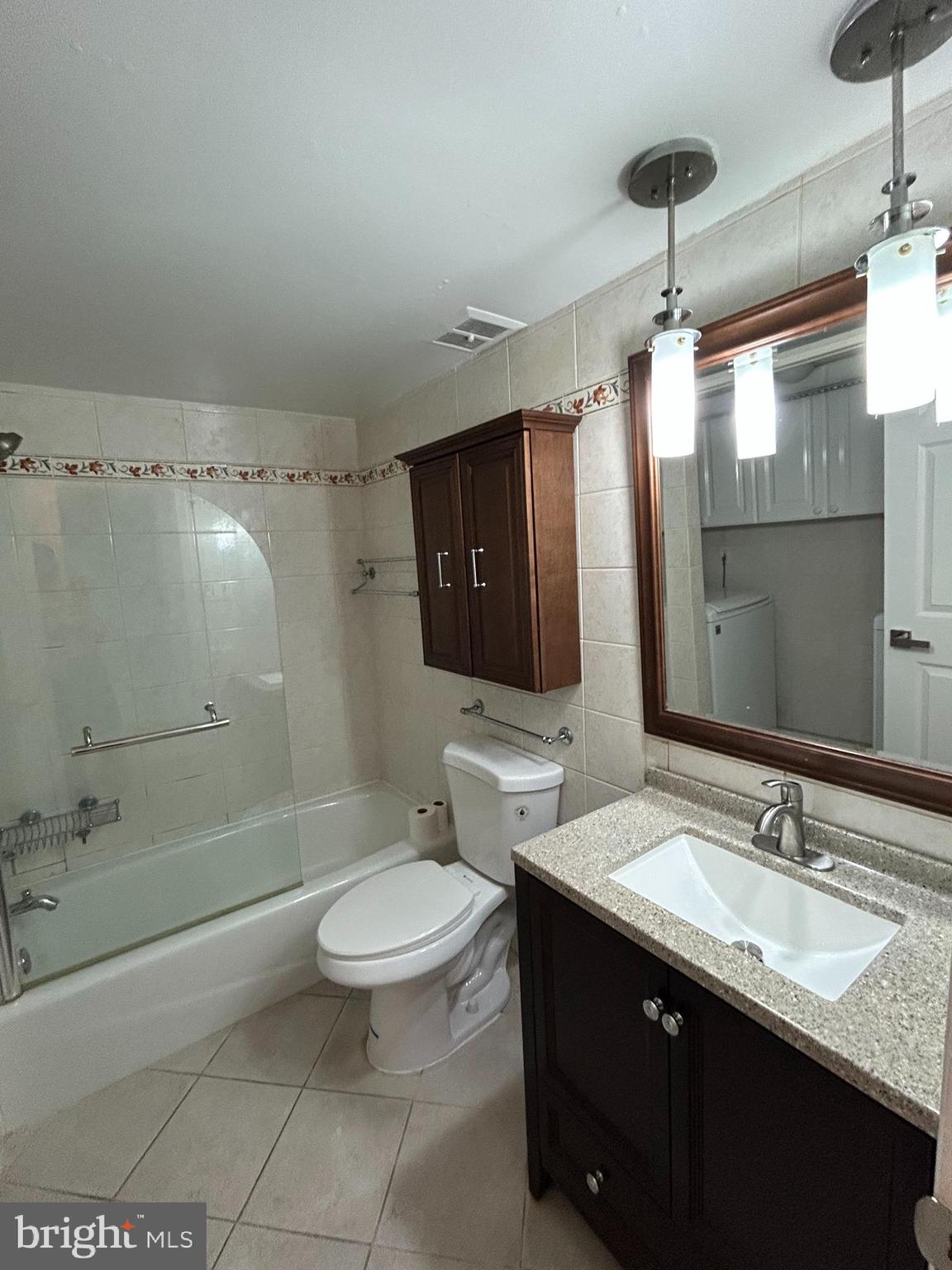 312 Old Forge Crossing, Unit 312 Devon, PA 19333 - Photo 18 of 21 a bathroom with a double vanity sink toilet mirror and bathtub