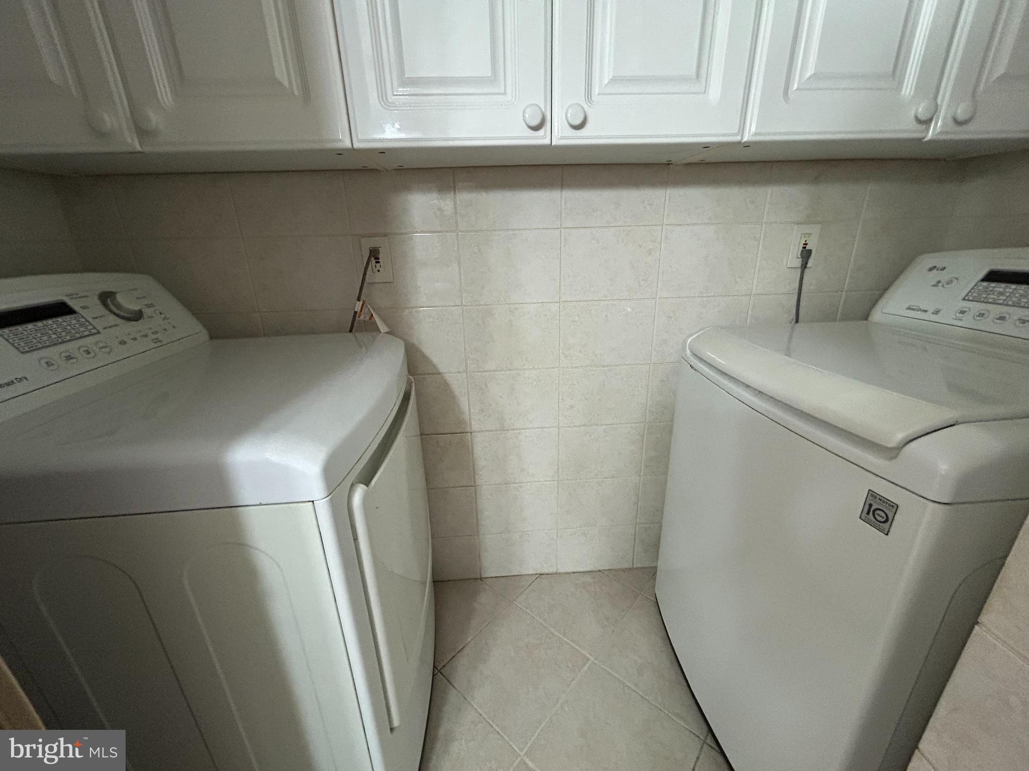 312 Old Forge Crossing, Unit 312 Devon, PA 19333 - Photo 21 of 21 a utility room with dryer and washer