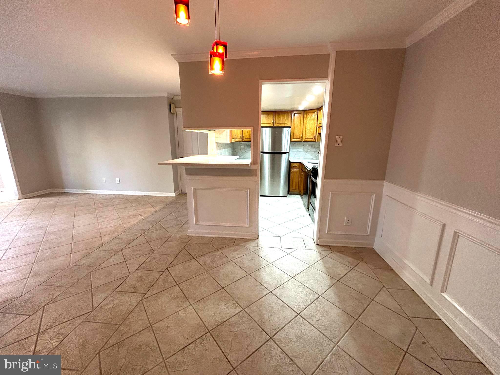 312 Old Forge Crossing, Unit 312 Devon, PA 19333 - Photo 5 of 21 a view of kitchen with furniture and window