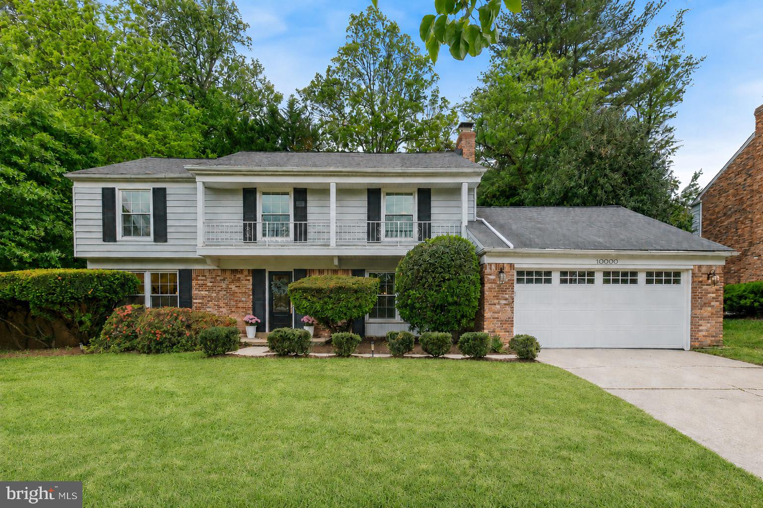 10900 Gainsborough Road Potomac, MD 20854 - Photo 41 of 44 a front view of house with yard and green space