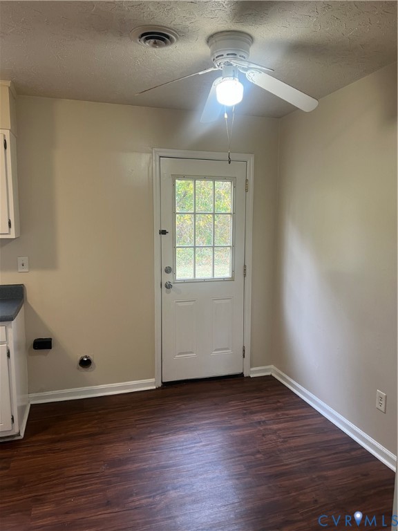 3605 Prince George Drive Prince George, VA 23875 - Photo 4 of 12 an empty room with wooden floor chandelier fan and windows