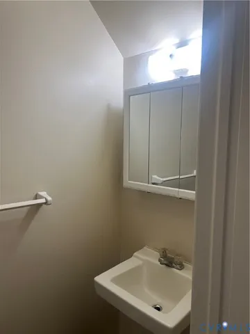 a bathroom with a sink a vanity and a mirror