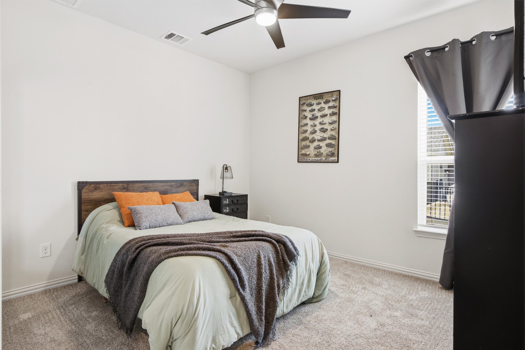192 Raptor Beak Way Cedar Creek, TX 78612 - Photo 27 of 38 Bedroom featuring neutral-toned carpeting and white walls