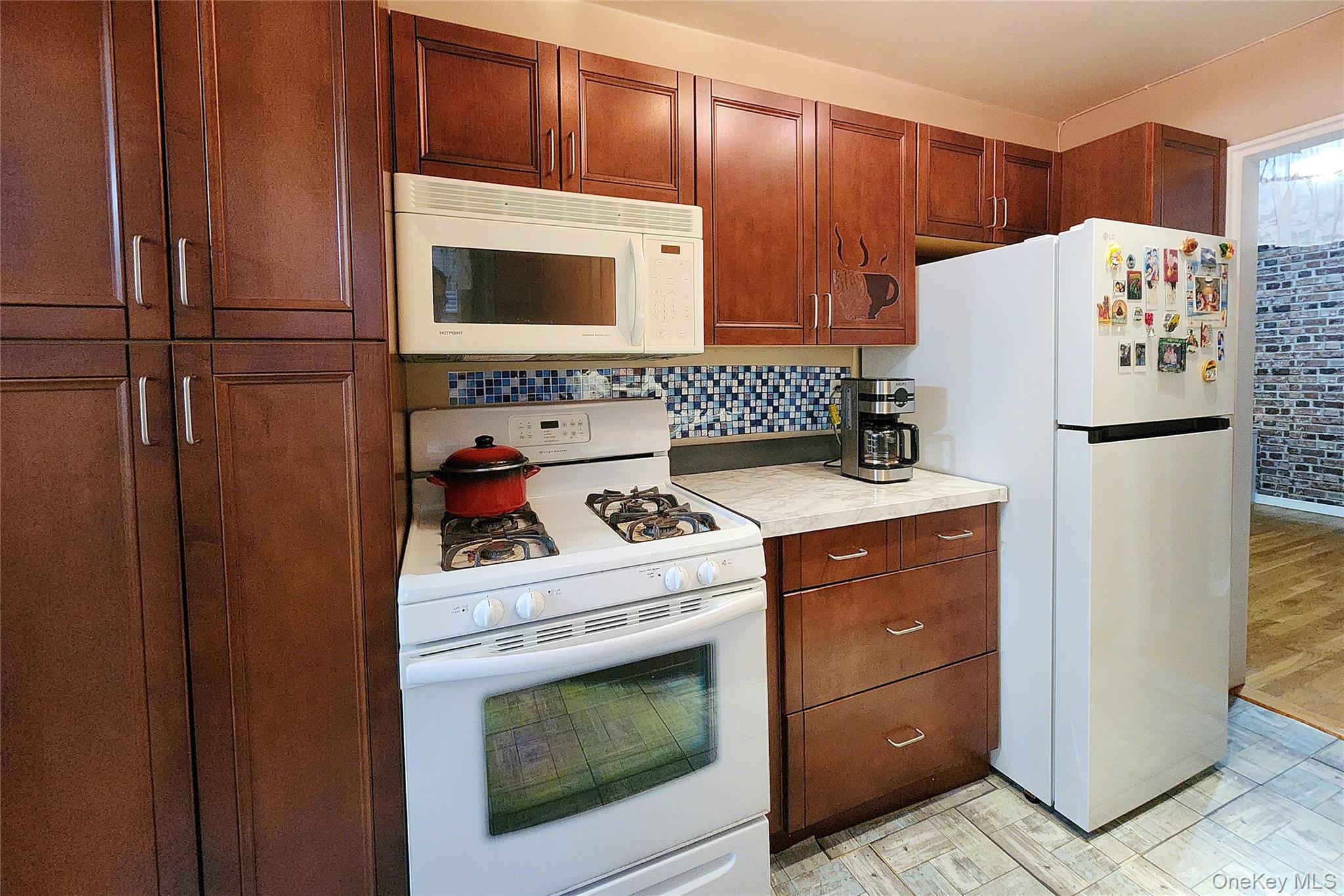 209-20 18th Avenue, Unit 5E Queens, NY 11360 - Photo 15 of 29 a utility room with dryer and washer