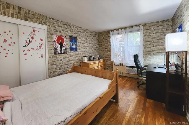 a bed room with a bed and a television