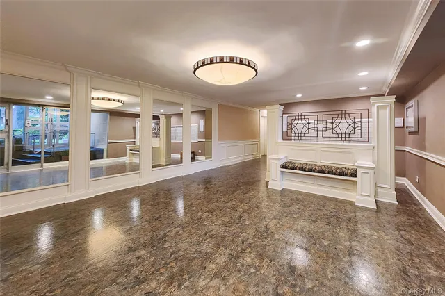 a utility room with dryer washer and a view of living room
