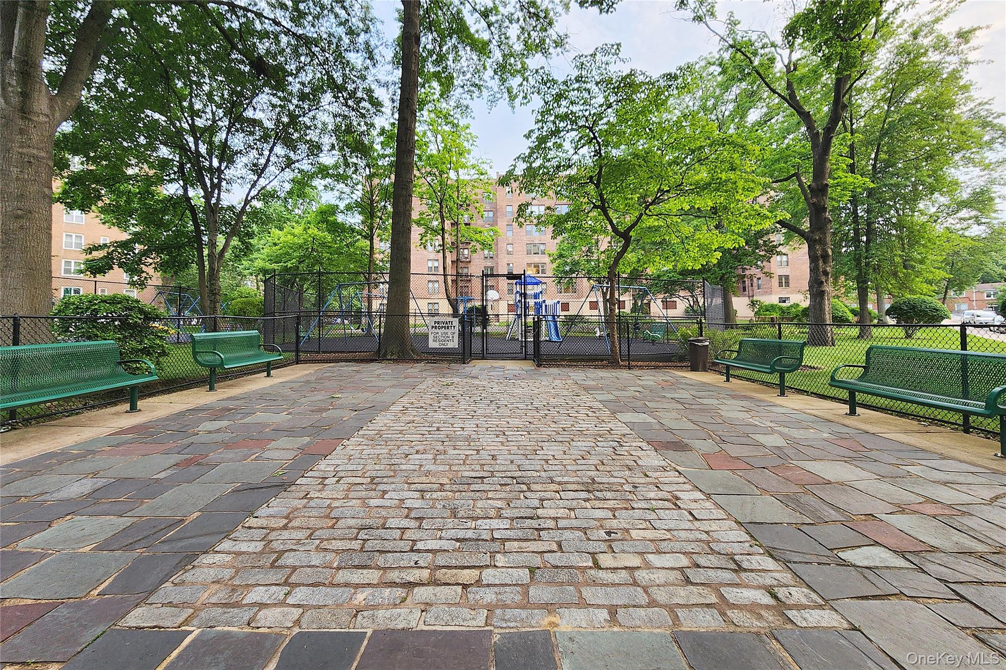 209-20 18th Avenue, Unit 5E Queens, NY 11360 - Photo 25 of 29 a view of a yard with plants and trees