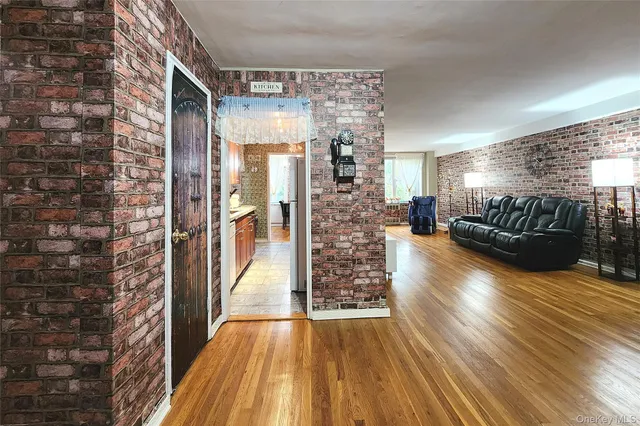 a view of kitchen with refrigerator and a fireplace