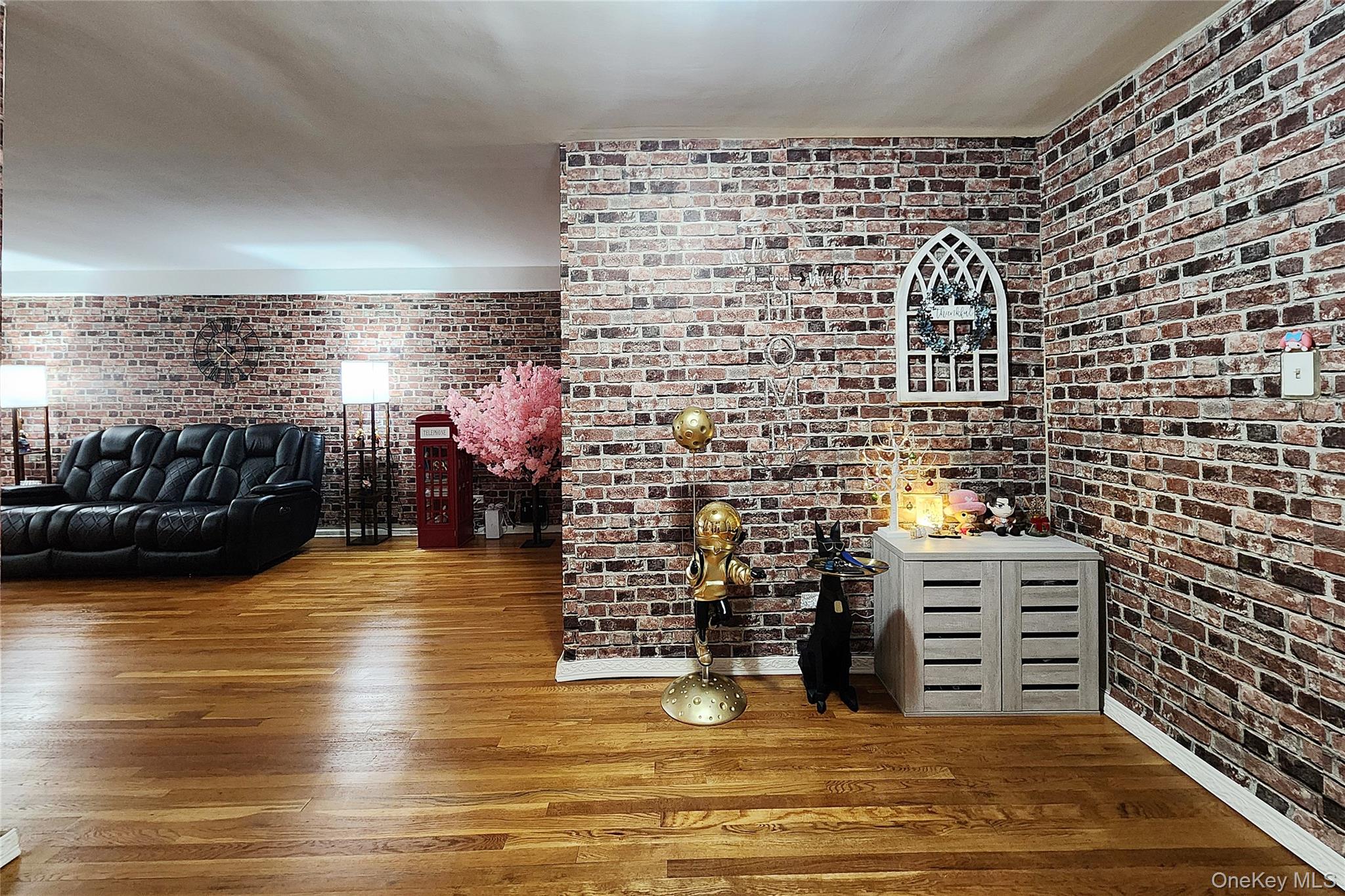 209-20 18th Avenue, Unit 5E Queens, NY 11360 - Photo 6 of 29 a view of kitchen with refrigerator and a fireplace