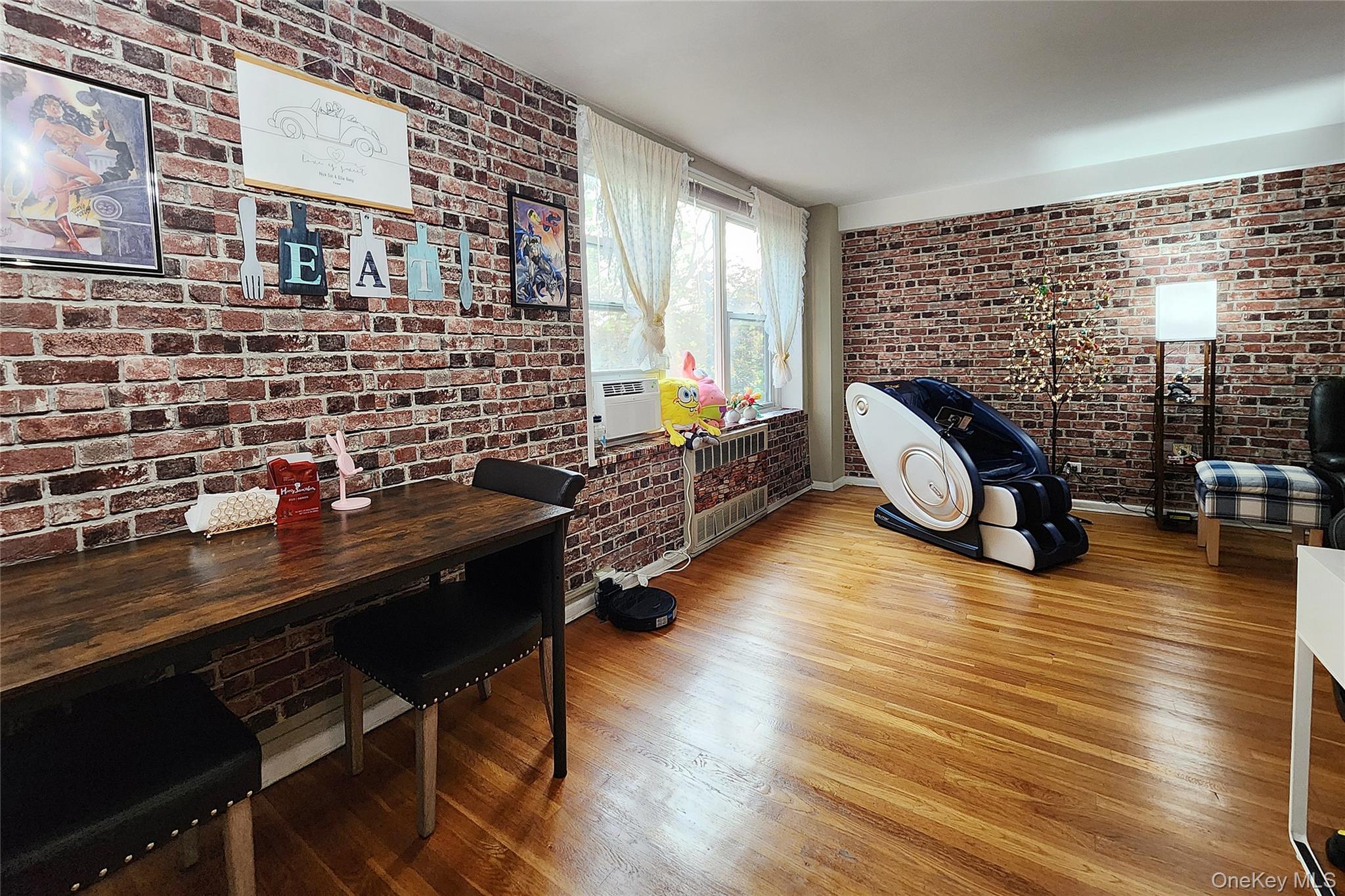 209-20 18th Avenue, Unit 5E Queens, NY 11360 - Photo 10 of 29 a view of a workspace with furniture and a window