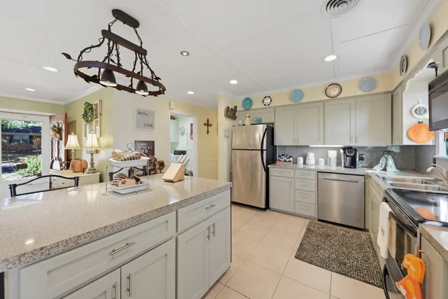 a kitchen with refrigerator and cabinets