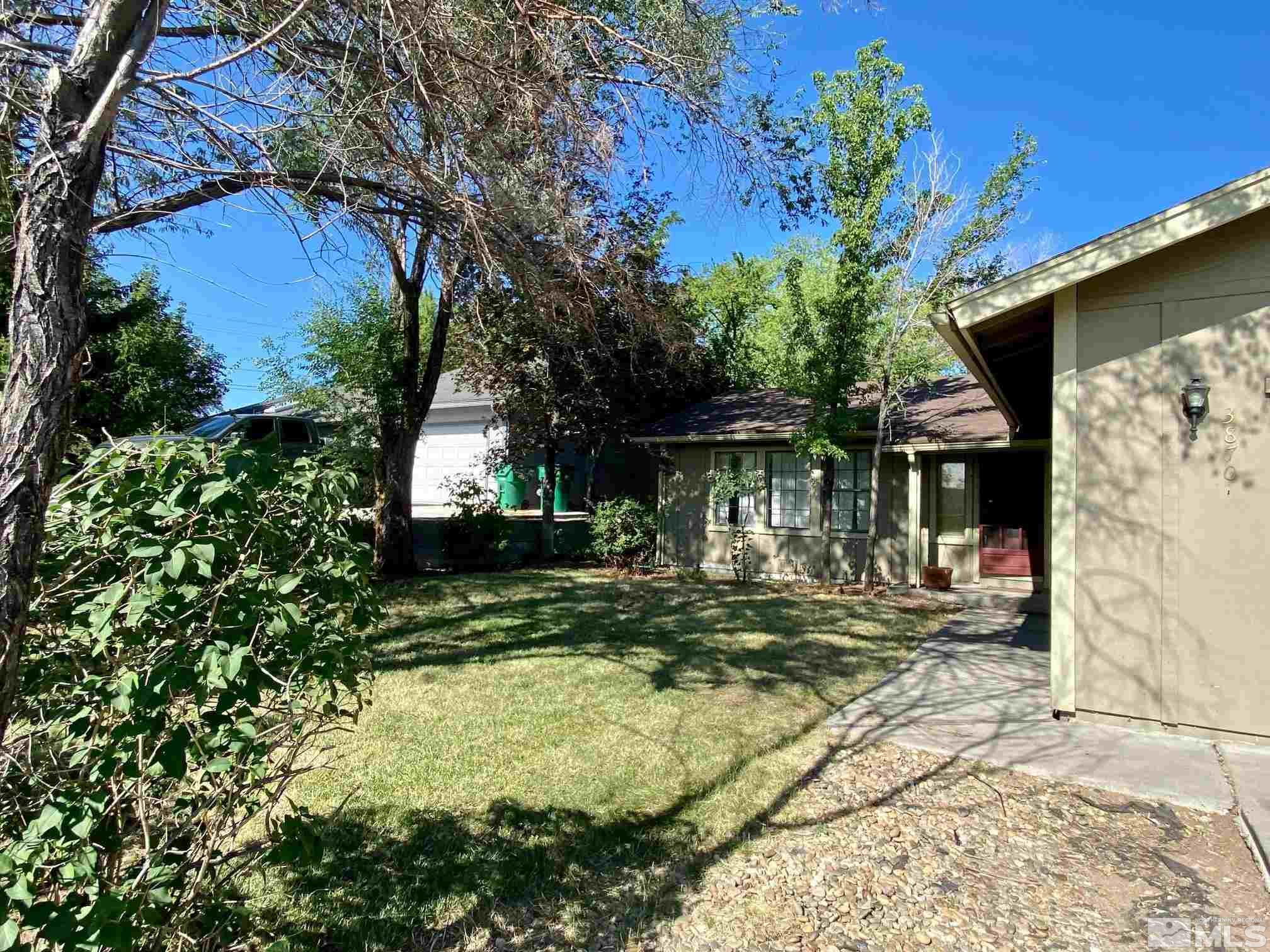 3870 West 7th Street Reno, NV 89503 - Photo 3 of 17 a view of a house with backyard sitting area and garden