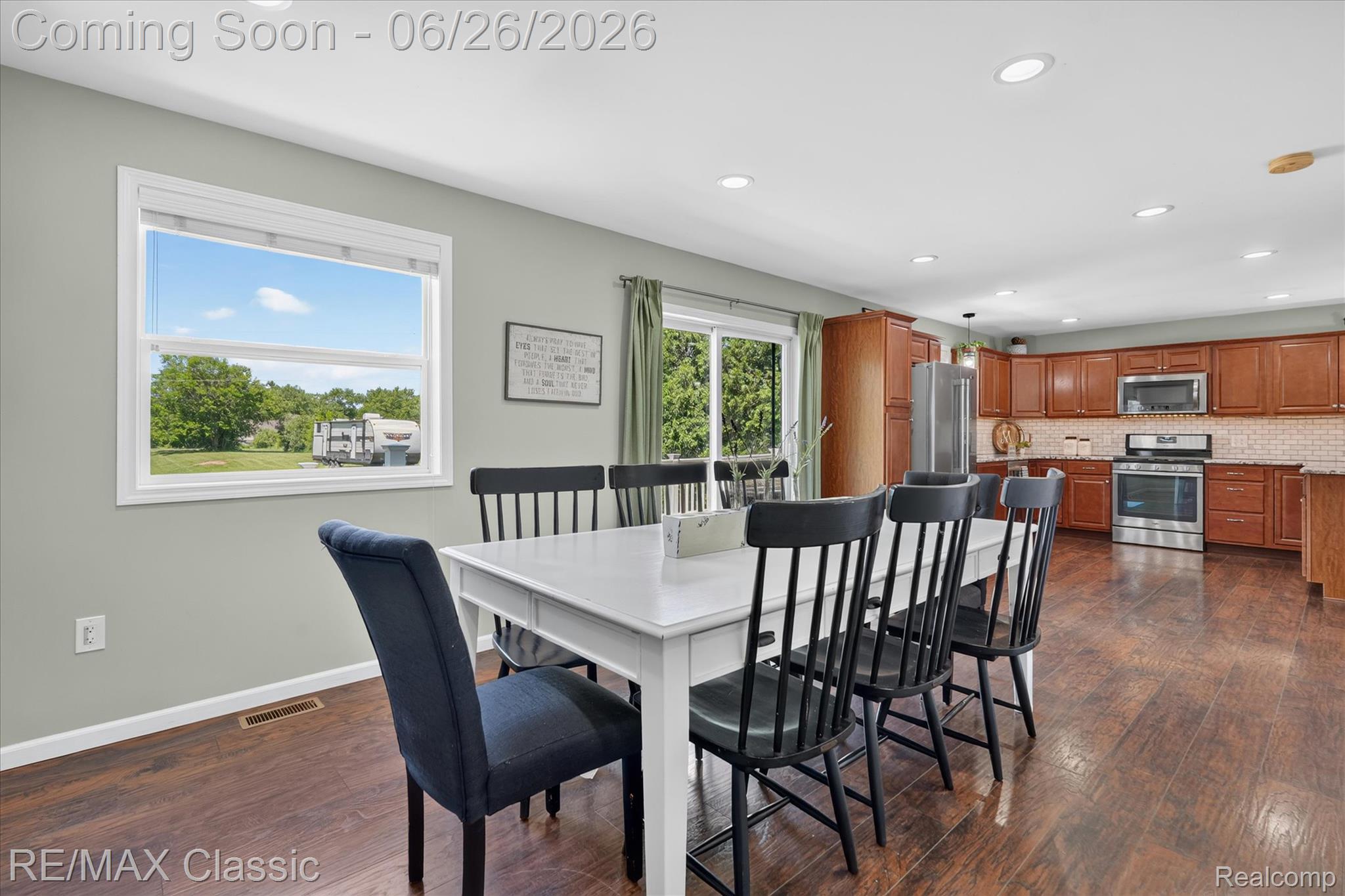 3205 North Milford Road Highland, MI 48357 - Photo 11 of 53 Open-concept dining area with wood-finish flooring, recessed lighting, and a window providing natural light