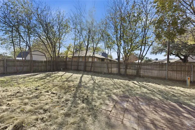 a street view with wooden fence
