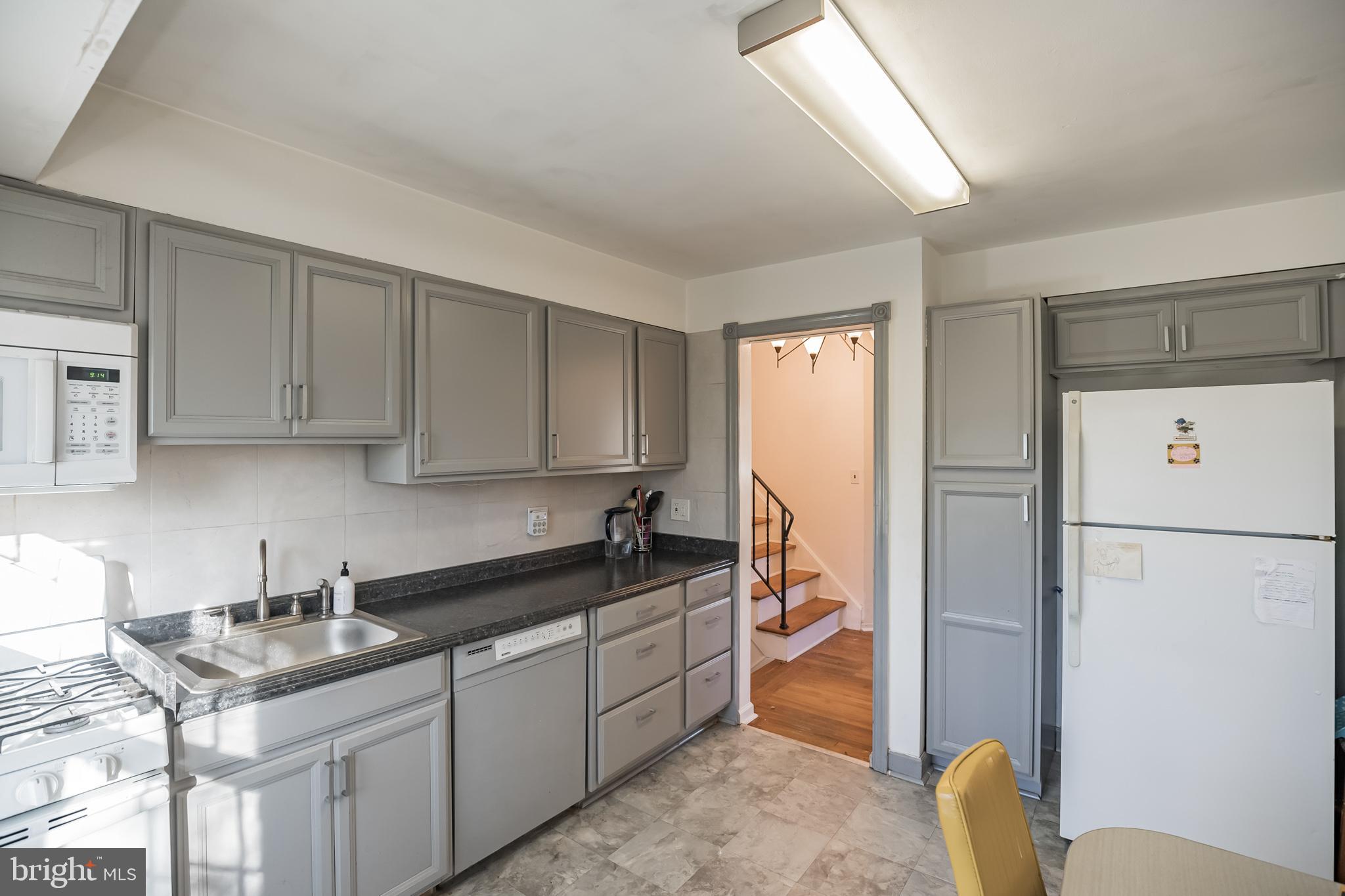 910 Woodlane Road Mount Holly, NJ 08060 - Photo 11 of 27 a kitchen with stainless steel appliances granite countertop a sink a refrigerator and a stove