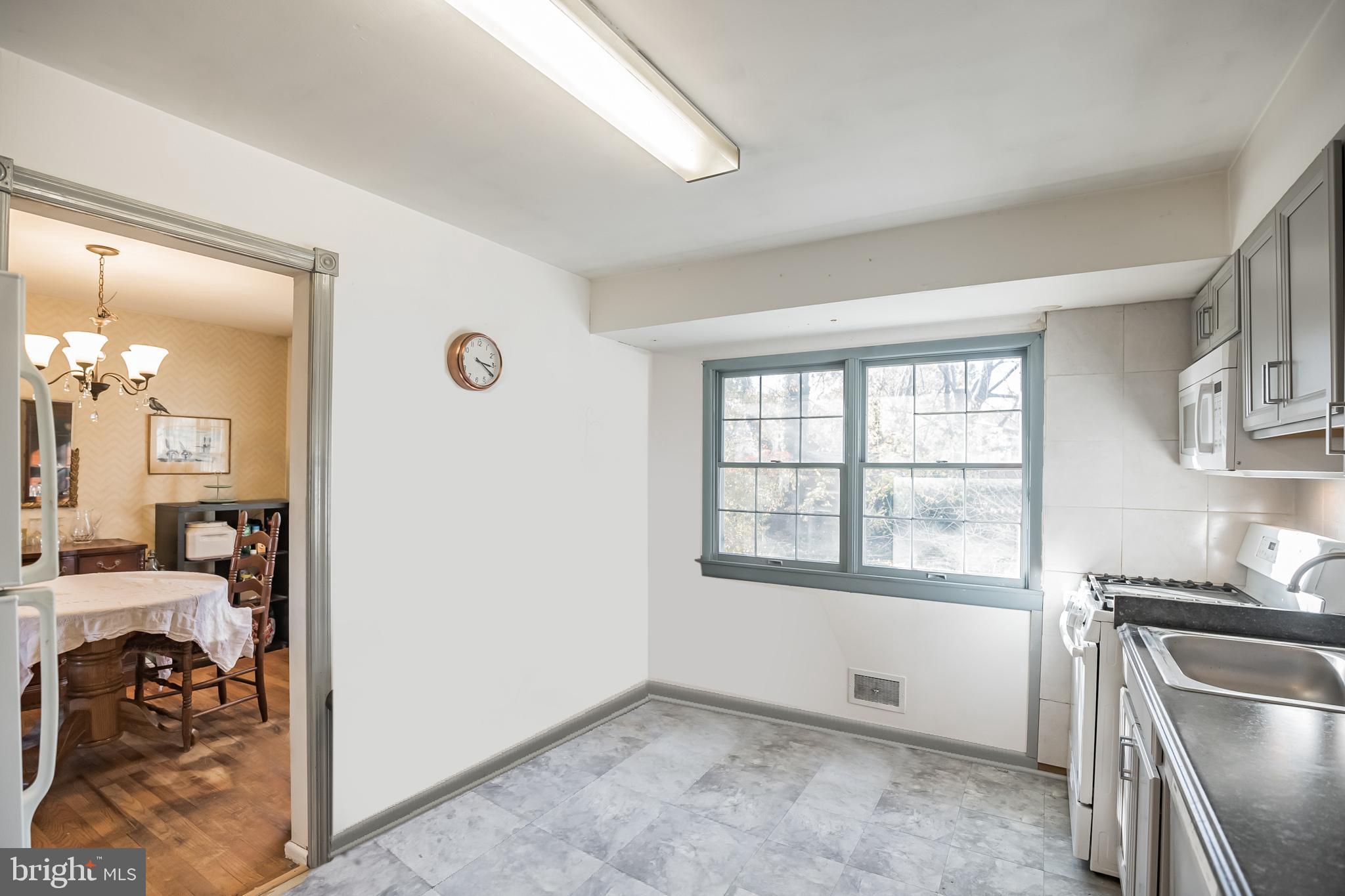 910 Woodlane Road Mount Holly, NJ 08060 - Photo 13 of 27 an empty room with a window and wooden floor