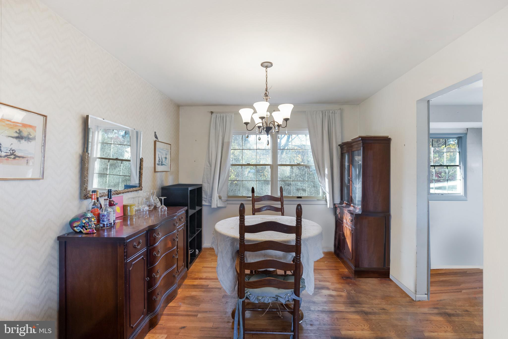 910 Woodlane Road Mount Holly, NJ 08060 - Photo 14 of 27 a living room with furniture and a chandelier