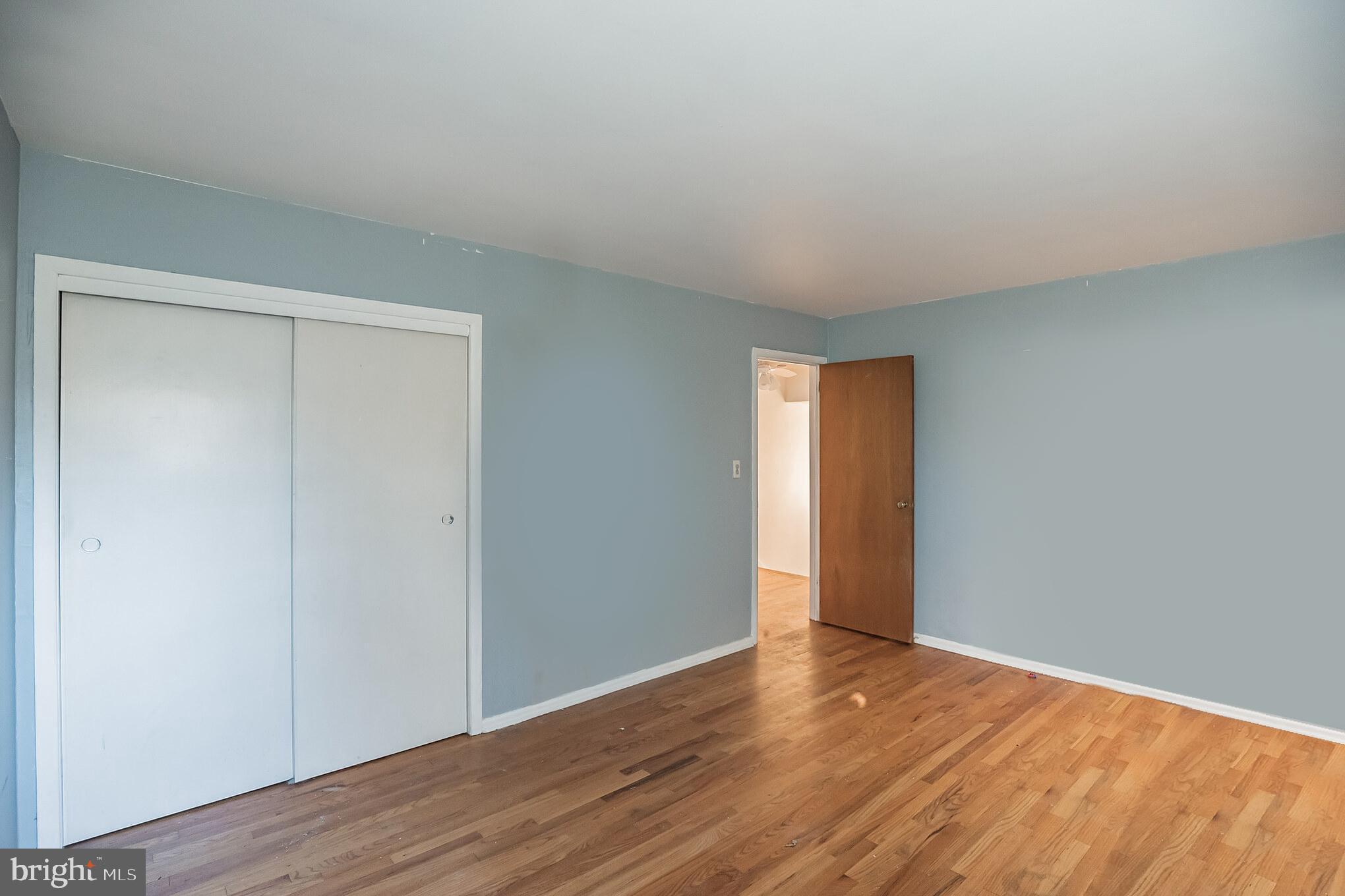 910 Woodlane Road Mount Holly, NJ 08060 - Photo 15 of 27 a view of an empty room with wooden floor and closet