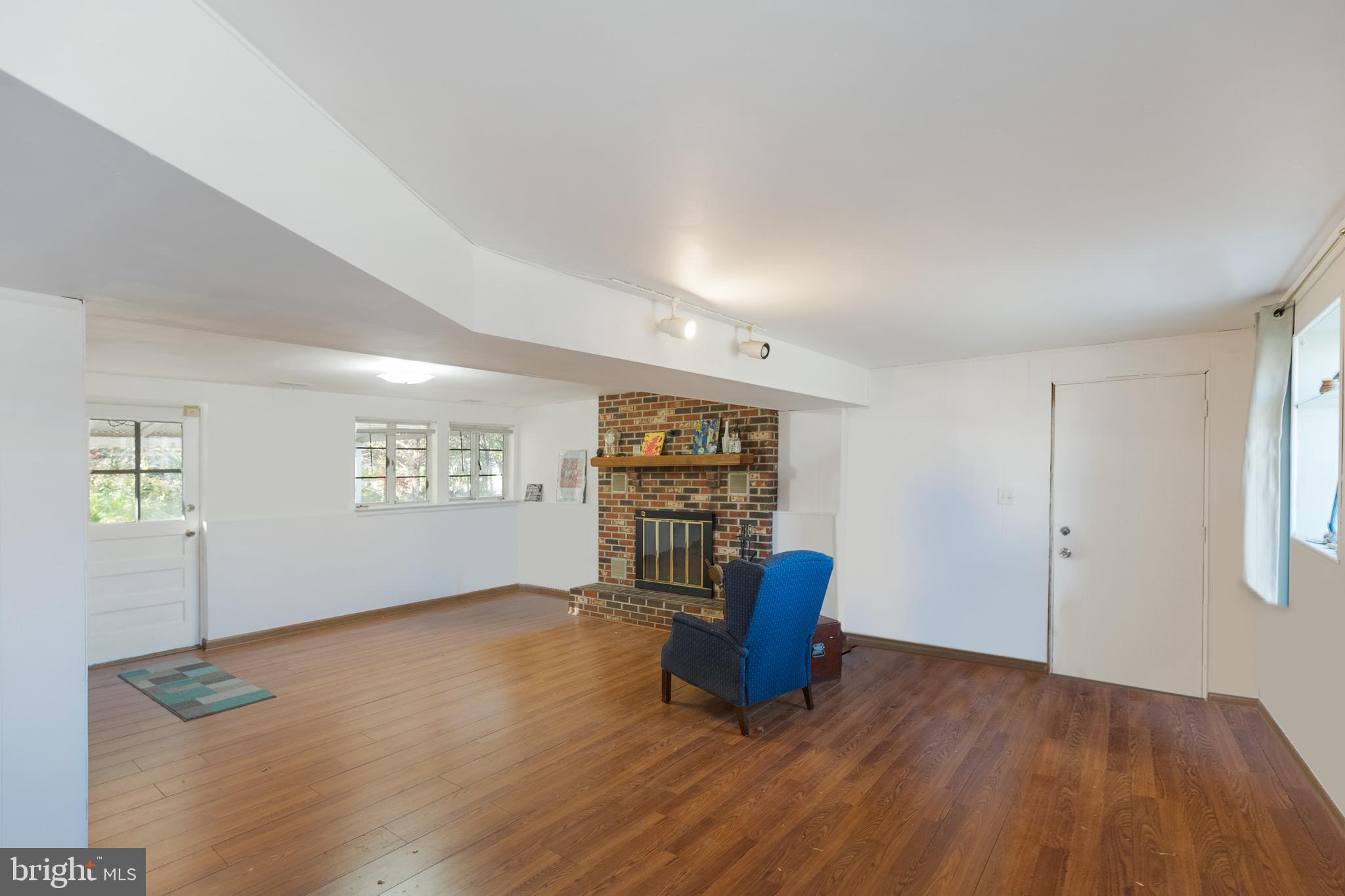 910 Woodlane Road Mount Holly, NJ 08060 - Photo 23 of 27 wooden floor in an empty room with a window