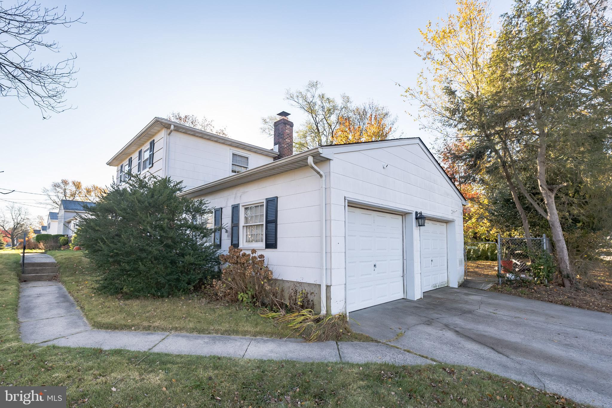 910 Woodlane Road Mount Holly, NJ 08060 - Photo 4 of 27 a view of a house with a yard and large tree
