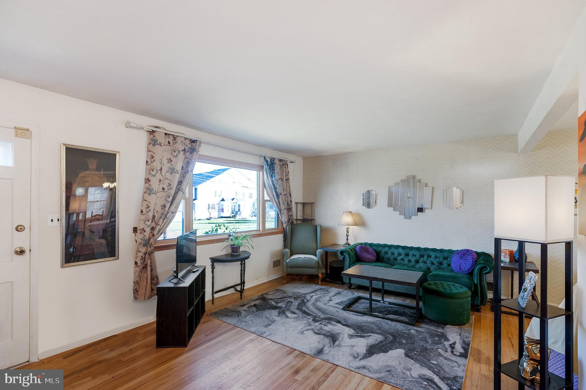 910 Woodlane Road Mount Holly, NJ 08060 - Photo 6 of 27 a living room with furniture window and wooden floor