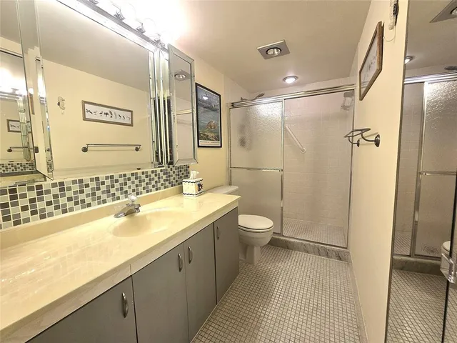 a view of a tree in middle of the green field